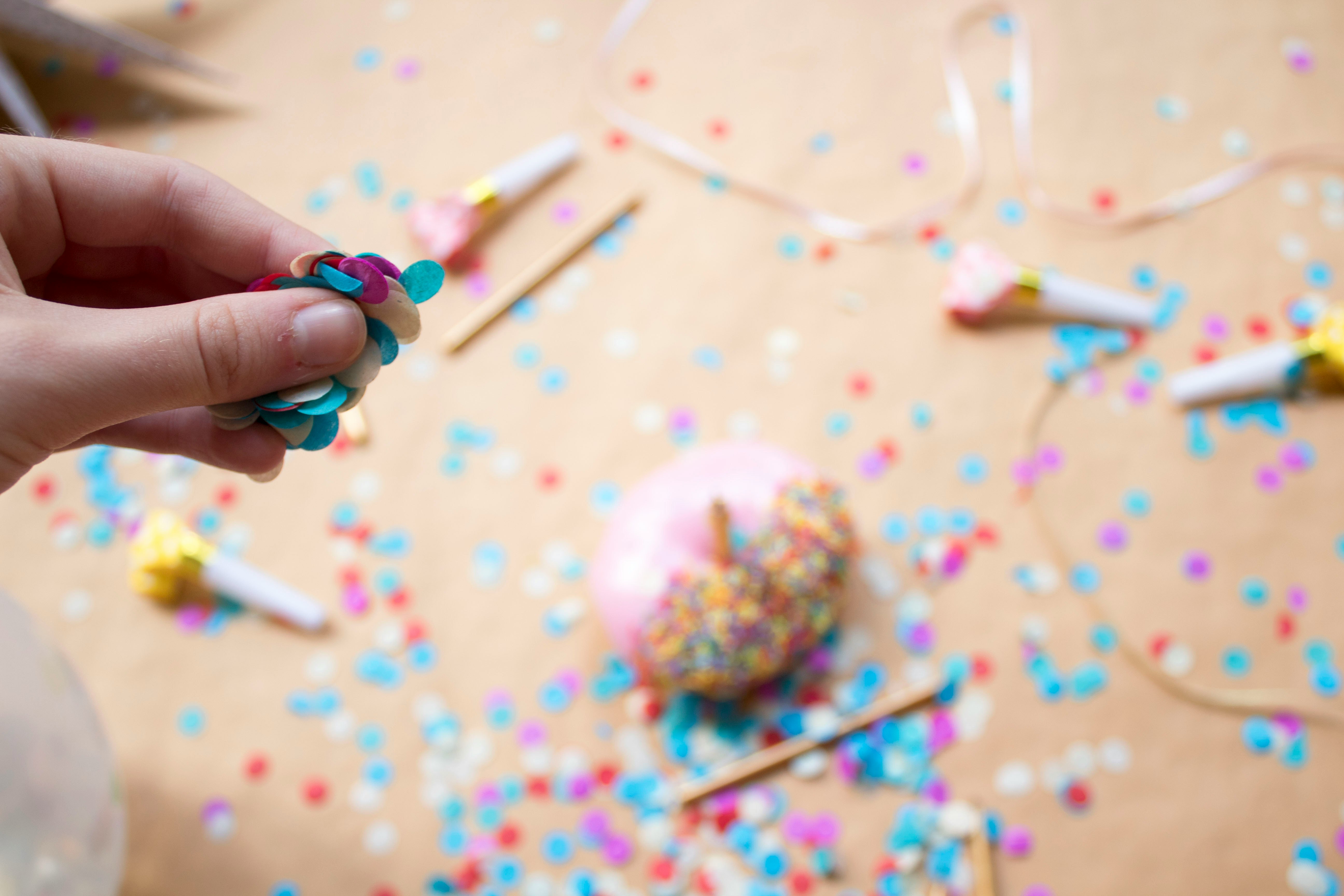 person holding assorted-color decors